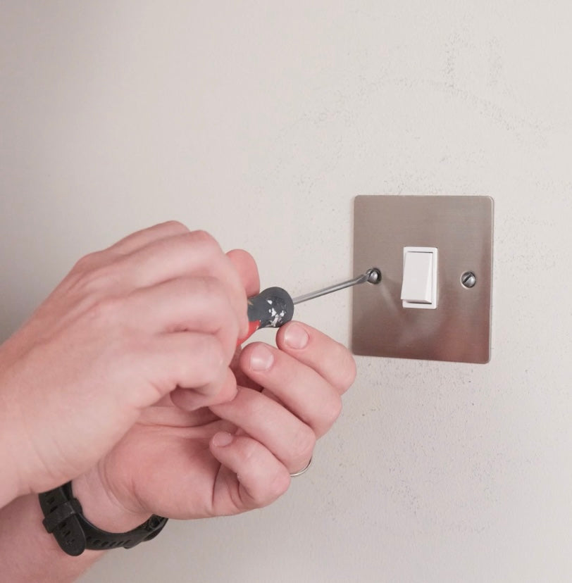 How to wallpaper round light switches and plug sockets